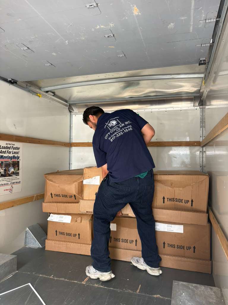 HVAC Technician Organizing Equipment